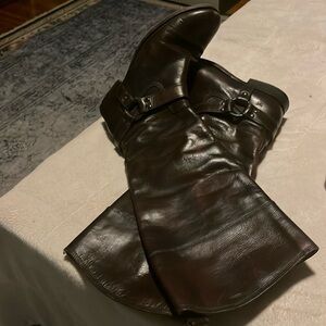 Knee high Frye brown leather boots.